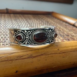 Vintage solid sterling silver with ruby gems and tiger eye in the middle